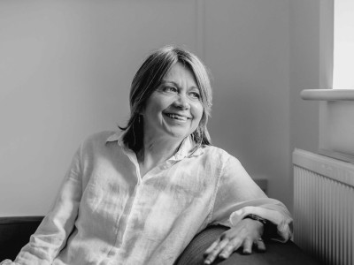 Rachel Bentley sitting next to window in Children on the Edge office