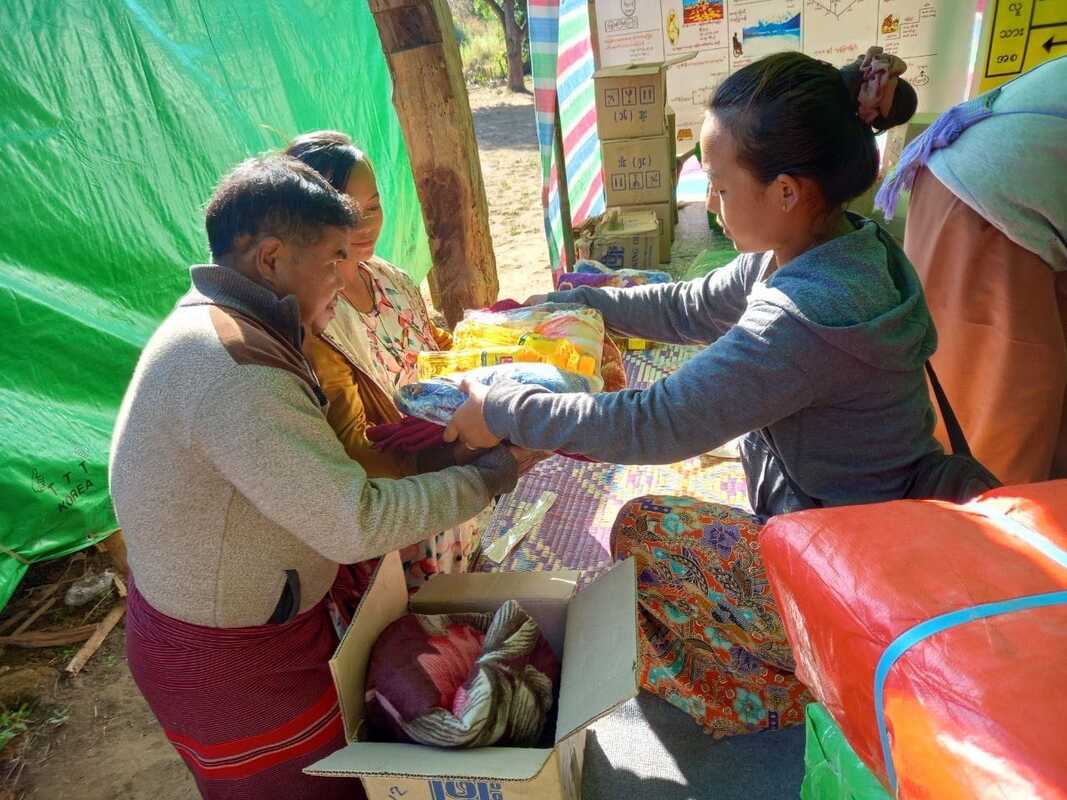 Emergency provisions being distributed in a tent in Kayah State, Myanmar